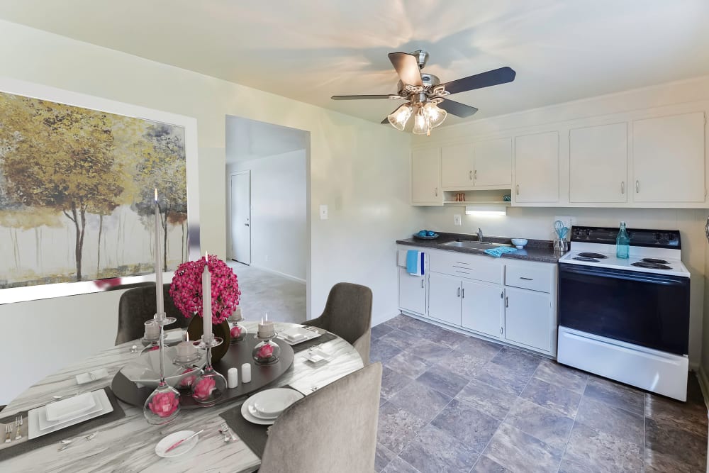 Stylish Dining Adjacent to Kitchen with Ceiling Fan at Wedgewood Hills Apartment Homes in Harrisburg, Pennsylvania