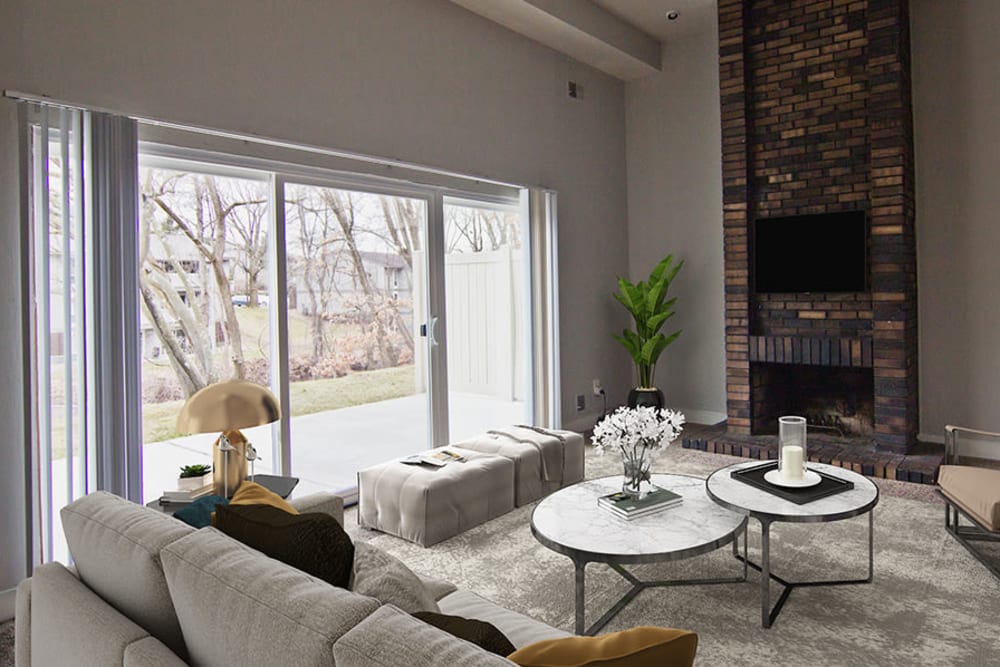 Living room in a townhome with floor to ceiling fireplace at Nineteen North Apartments in Pittsburgh, Pennsylvania
