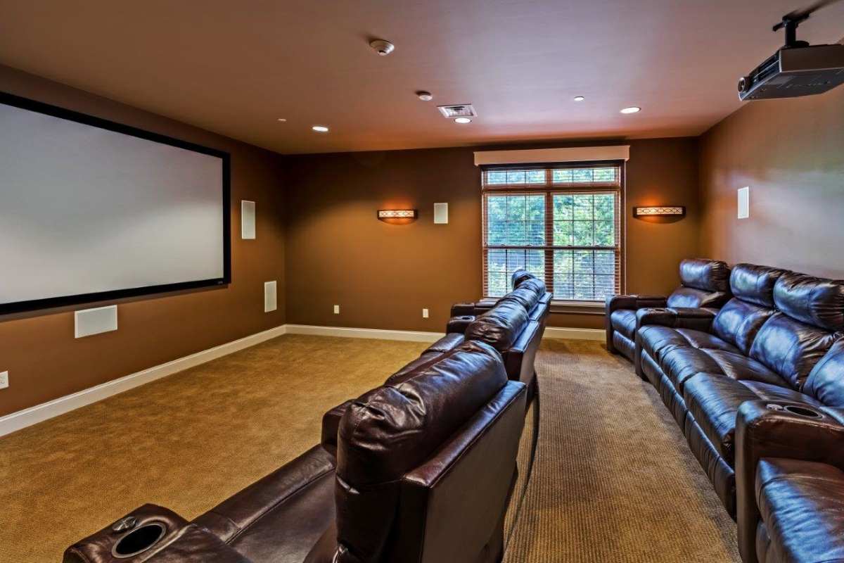 Spacious theater room with comfortable seating at Reserve at Southpointe in Canonsburg, Pennsylvania