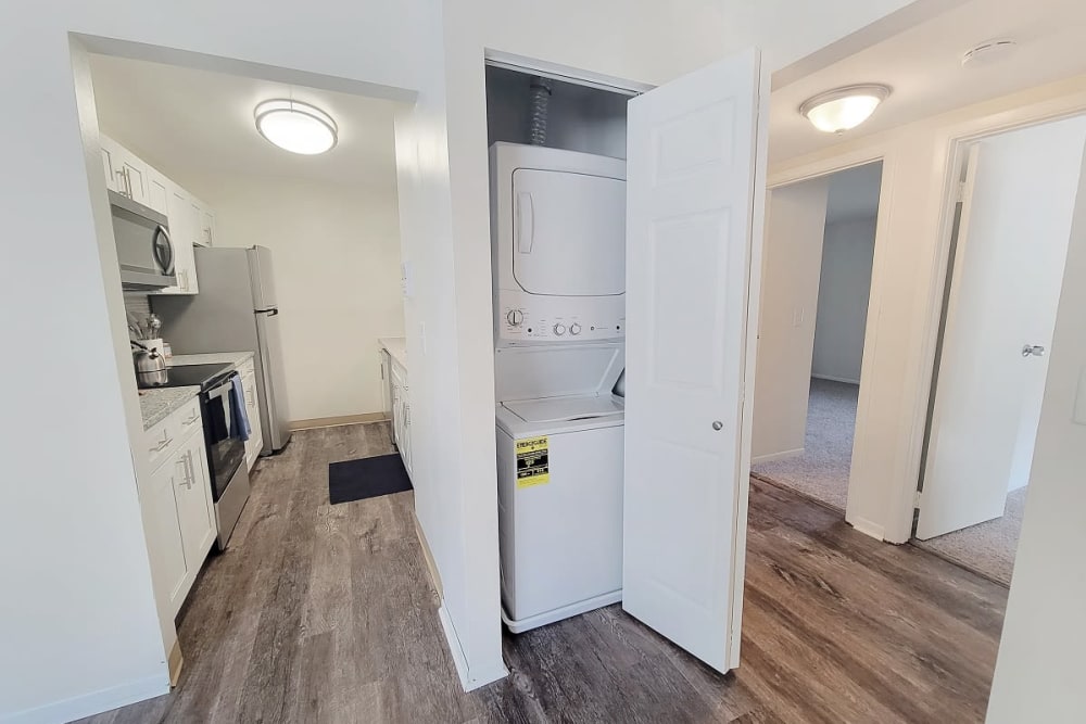 In-home stackable washer and dryer at Squires Manor Apartment Homes in South Park, Pennsylvania