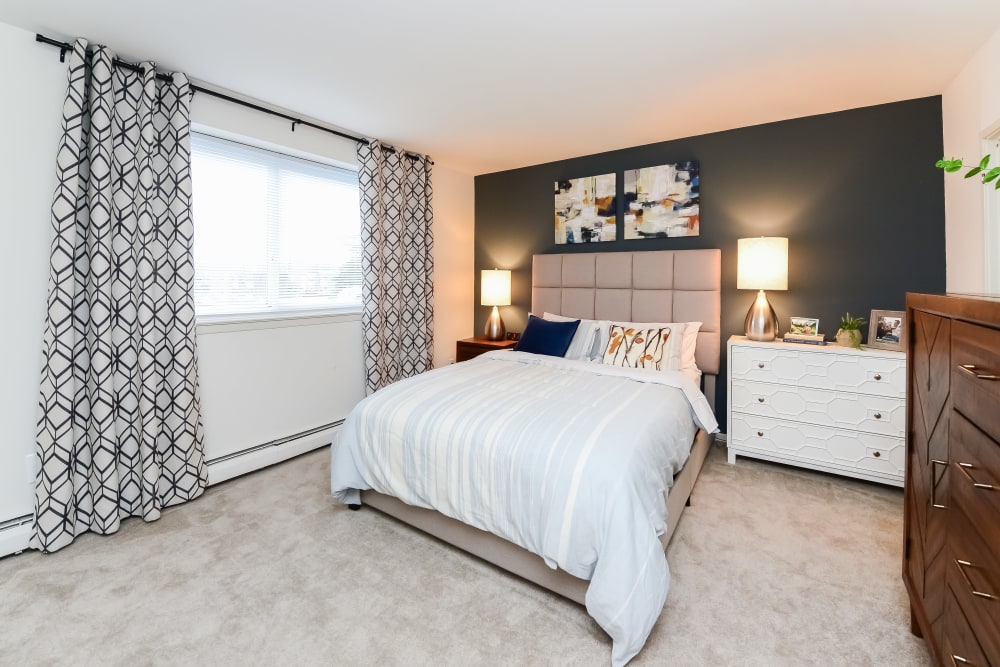 Well-Lit Bedroom with Plush Carpeting at Sherwood Crossing Apartments & Townhomes in Philadelphia, Pennsylvania