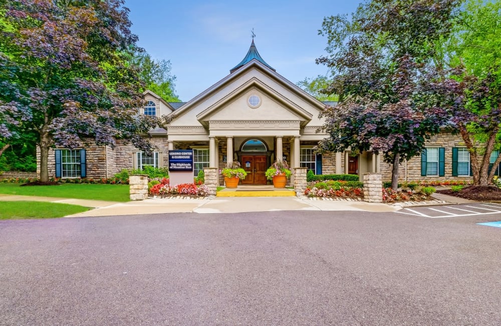 Apartment entrance surrounded by well trimmed hedges Highlands of Montour Run in Coraopolis, Pennsylvania