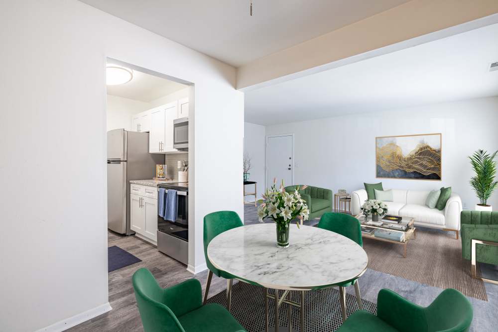 Dining area with vinyl plank flooring at Squires Manor Apartment Homes in South Park, Pennsylvania