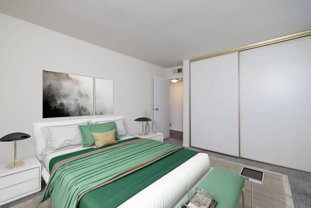 Carpeted Bedroom with Large Closet at Squires Manor Apartment Homes in South Park, Pennsylvania