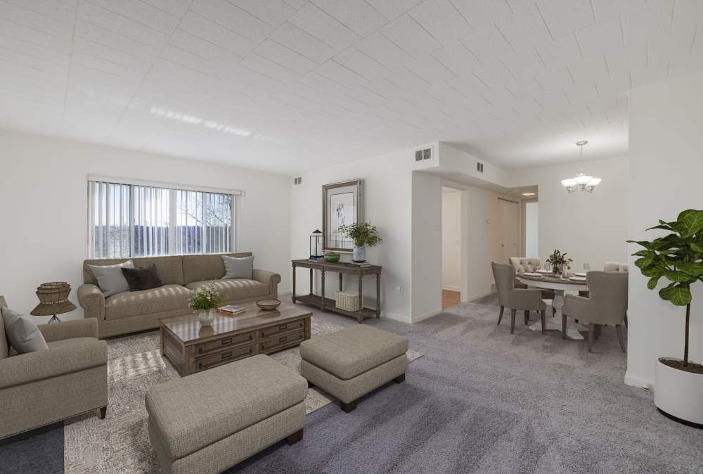 Living space with carpet at The Avalon Apartment Homes in Avalon, Pennsylvania