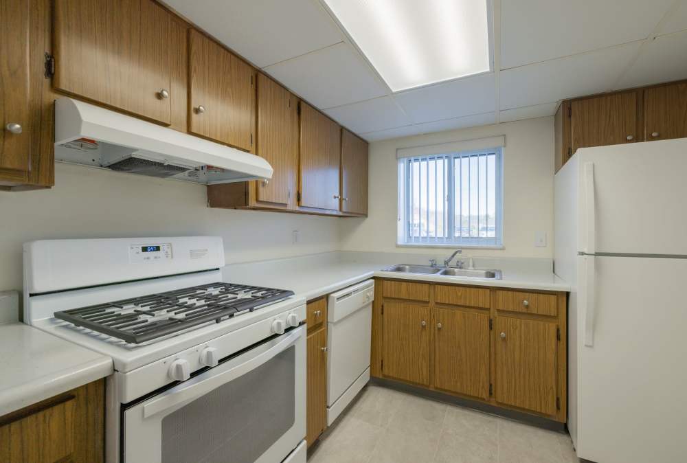 Kitchen with wood cabinets at The Avalon Apartment Homes in Avalon, Pennsylvania