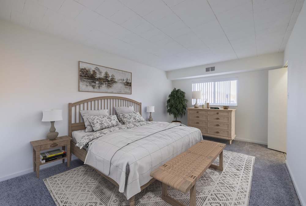 Bedroom with large rug at The Avalon Apartment Homes in Avalon, Pennsylvania