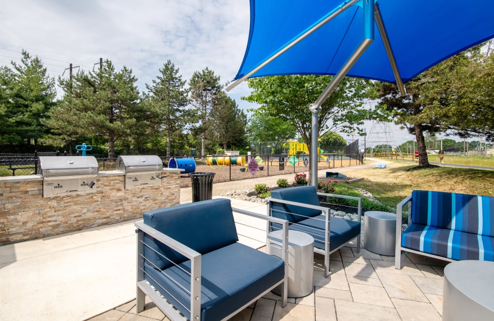 Outdoor lounge area with a fire pit at Abrams Run Apartment Homes in King of Prussia, Pennsylvania