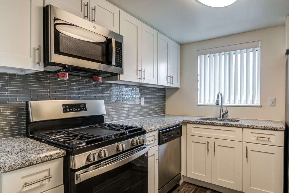 Kitchen with white cabinets at The Avalon Apartment Homes in Avalon, Pennsylvania