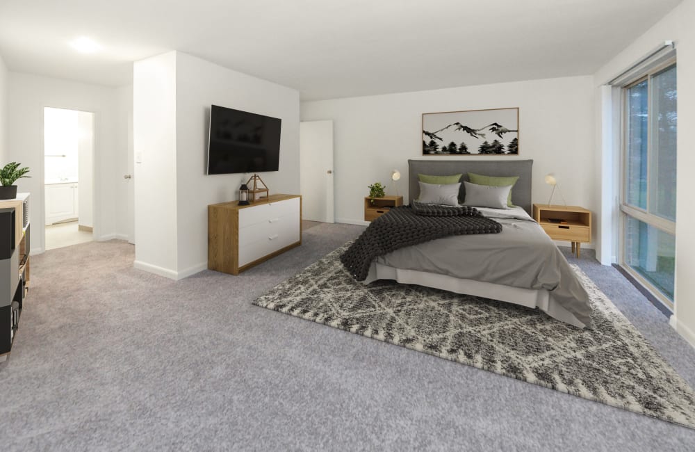 Luxurious and spacious bedroom with access to natural lighting at Lakewood Hills Apartments & Townhomes in Harrisburg, Pennsylvania