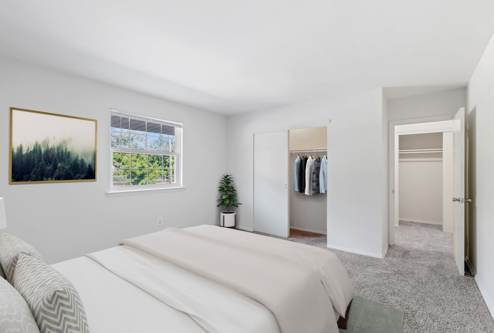 Bedroom with carpet and closet at Burnt Mill Apartment Homes in Voorhees, New Jersey
