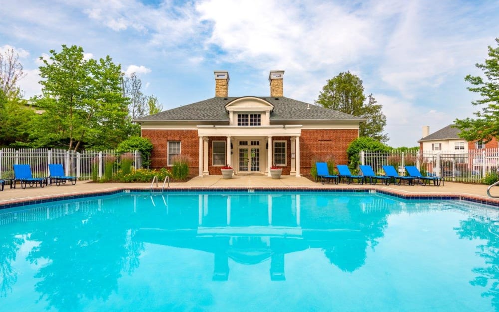 Swimming pool and sunny lounge chairs at Christopher Wren Apartments & Townhomes in Wexford, Pennsylvania