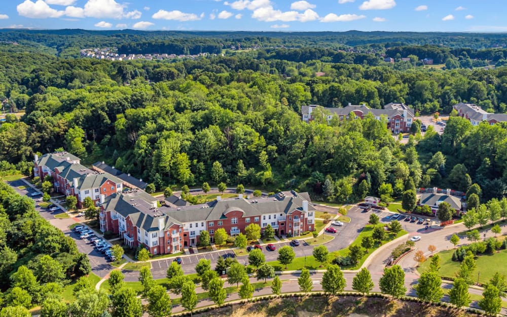 Couple out for a walk with their baby near their home at Christopher Wren Apartments & Townhomes in Wexford, Pennsylvania
