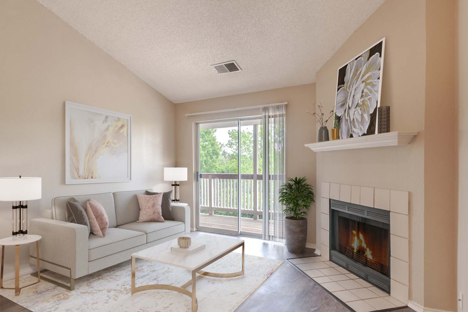 Open livingroom with a fireplace and french doors to balcony at Club at North Hills in Pittsburgh, Pennsylvania