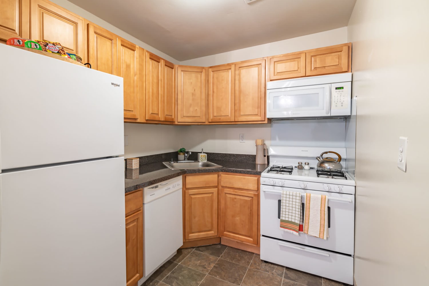 Model kitchen with maple cabinets at Country Village Apartment Homes in Dover, Delaware