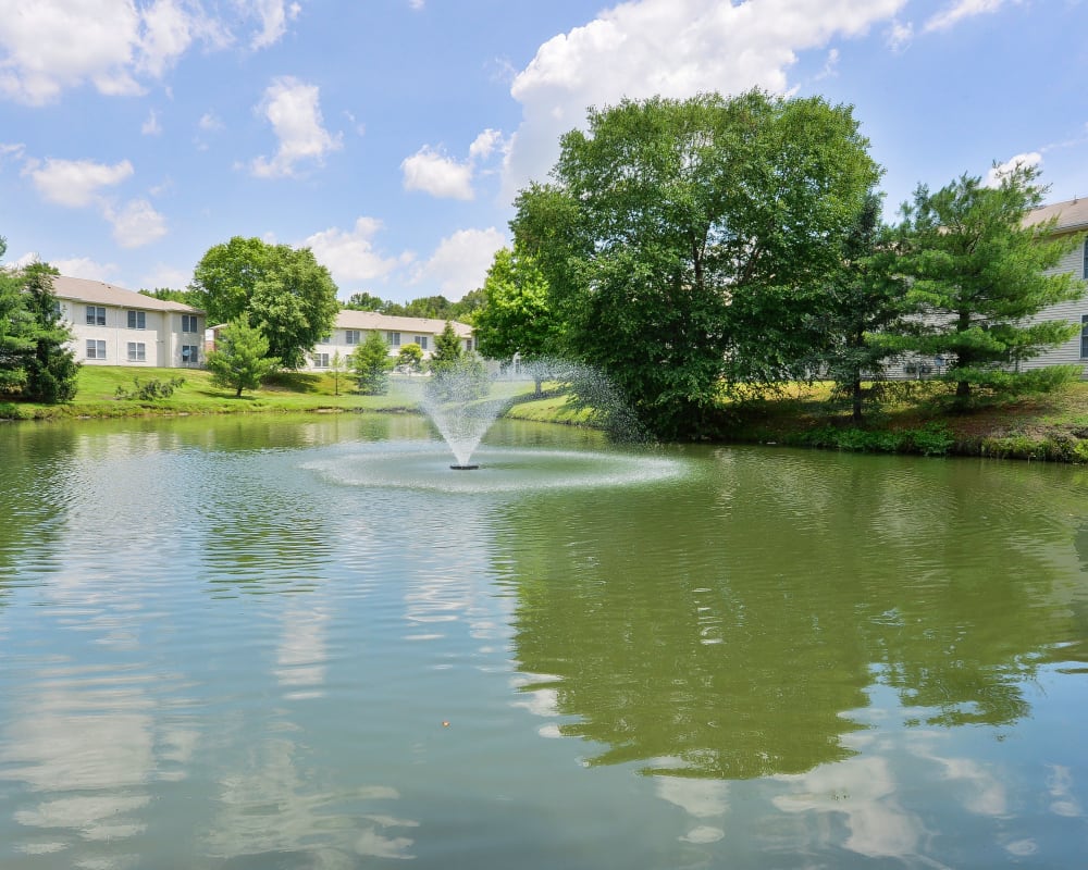 Lake with a fountain at Woodview at Marlton Apartment Homes in Marlton, New Jersey