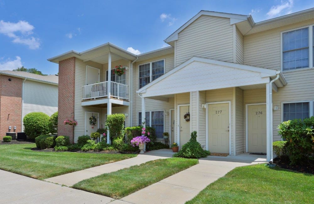 Exterior with lush lawn at Woodview at Marlton Apartment Homes in Marlton, New Jersey