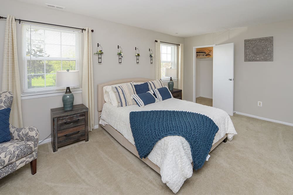 Bedroom with large windows and attached closet at Lumberton Apartment Homes in Lumberton, New Jersey