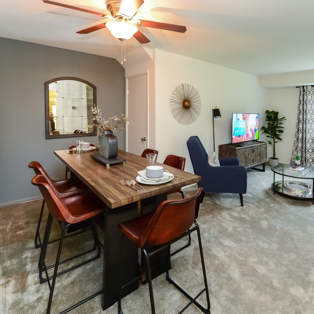 Dining area and living room in an open floor plan model home at Montgomery Woods Townhomes in Harleysville, Pennsylvania
