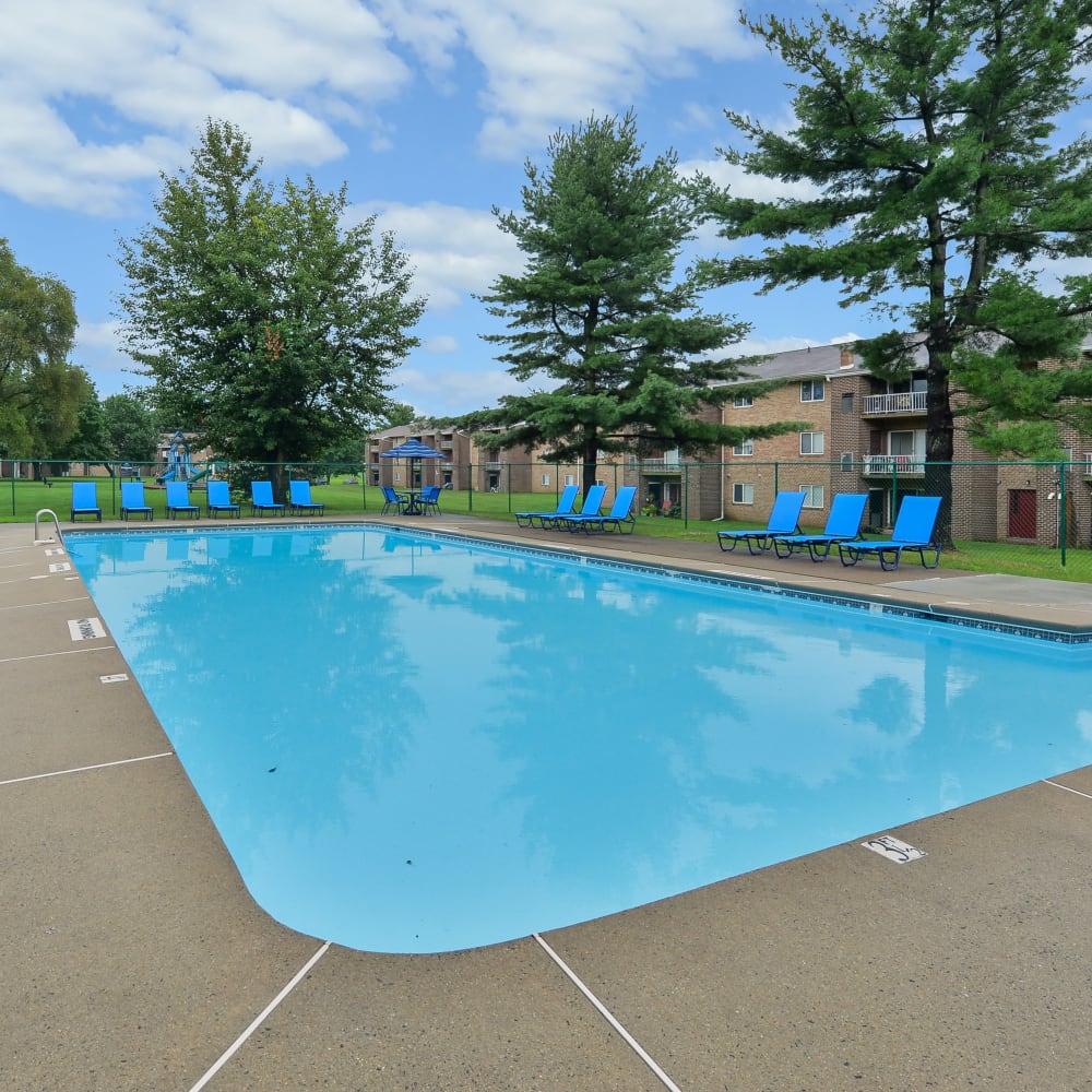 Swimming pool with lounge seating at Wedgewood Hills Apartment Homes in Harrisburg, Pennsylvania