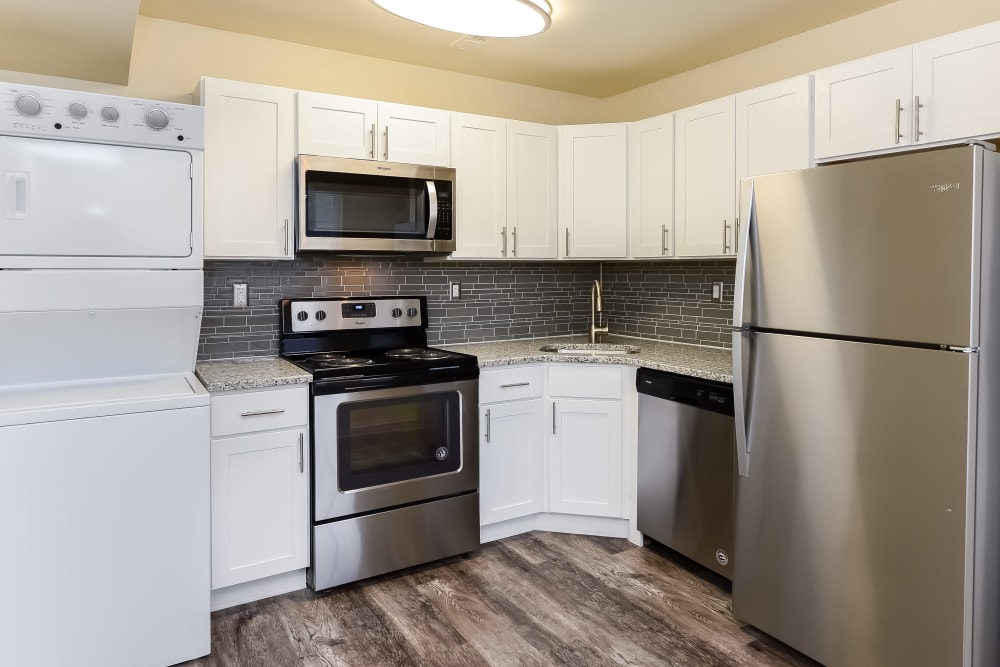 Kitchen with white cabinets and stainless-steel appliances at Lumberton Apartment Homes in Lumberton, New Jersey