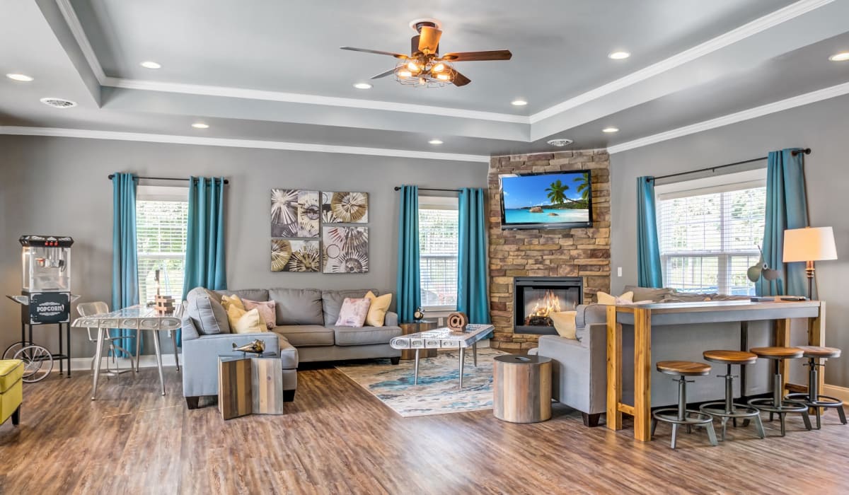Large living room with a fireplace and an open layout at Emerald Pointe Townhomes in Harrisburg, Pennsylvania