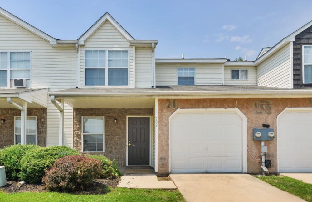Exterior with private patio and lush lawn at Fox Run Apartments & Townhomes in Bear, Delaware