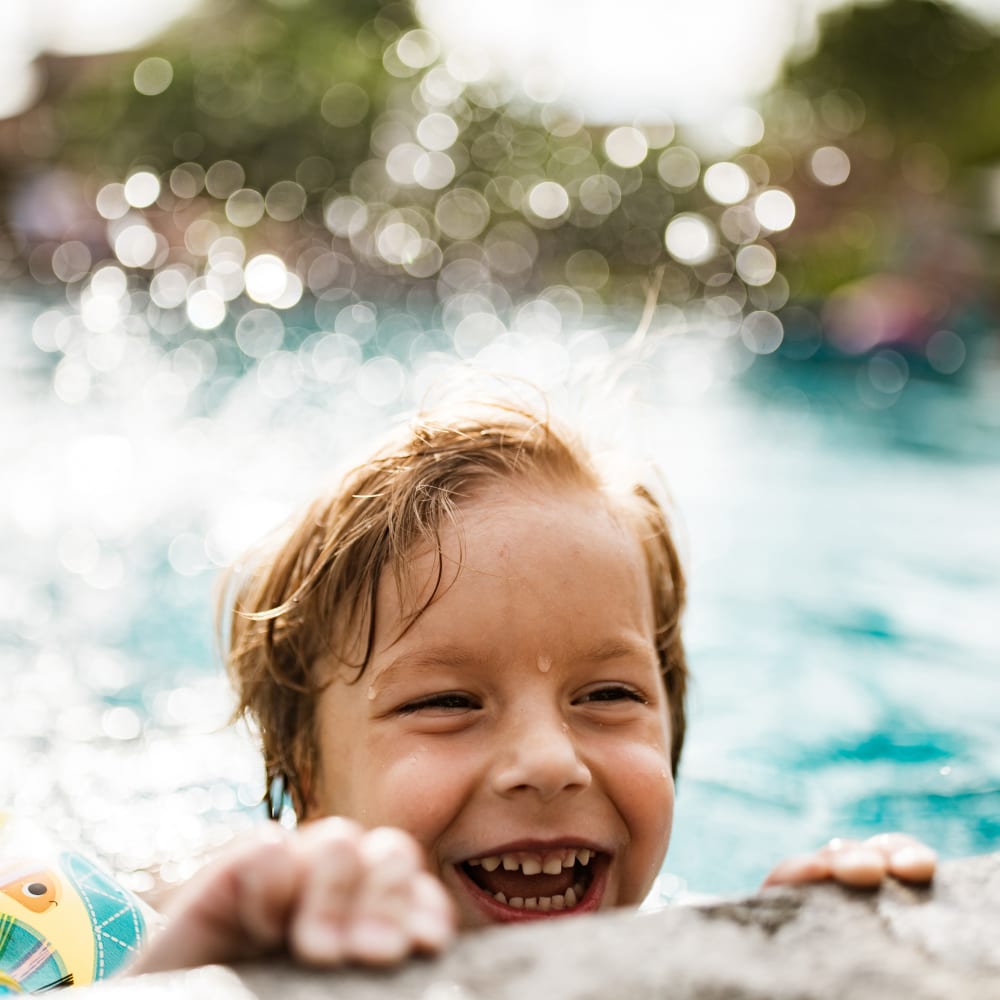 Child playing in the swimming pool at Mapleton Square Apartment Homes in Dover, Delaware
