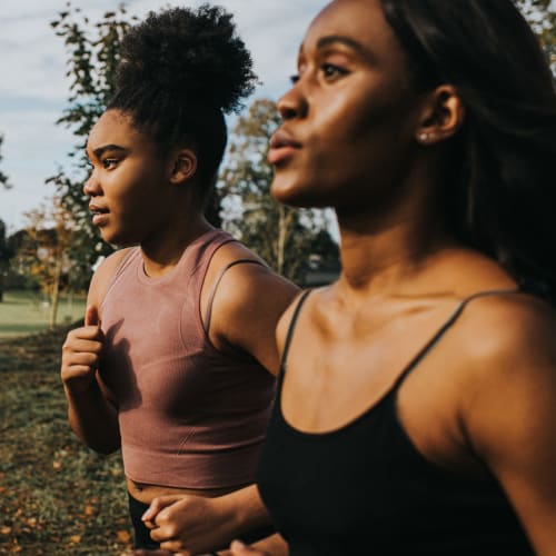 Residents on a morning jog through a park near Silver Spring Station Apartment Homes in Baltimore, Maryland