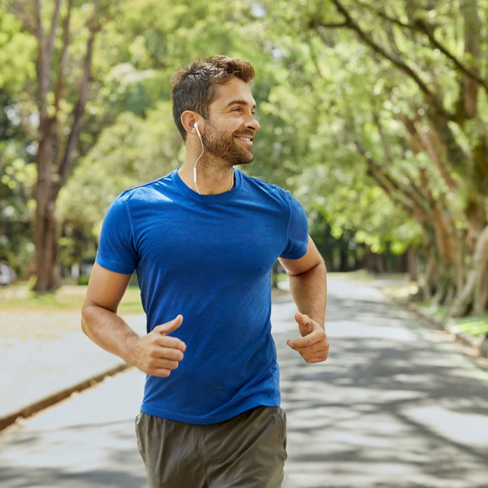 Resident running through a park near Park Place of South Park in South Park, Pennsylvania