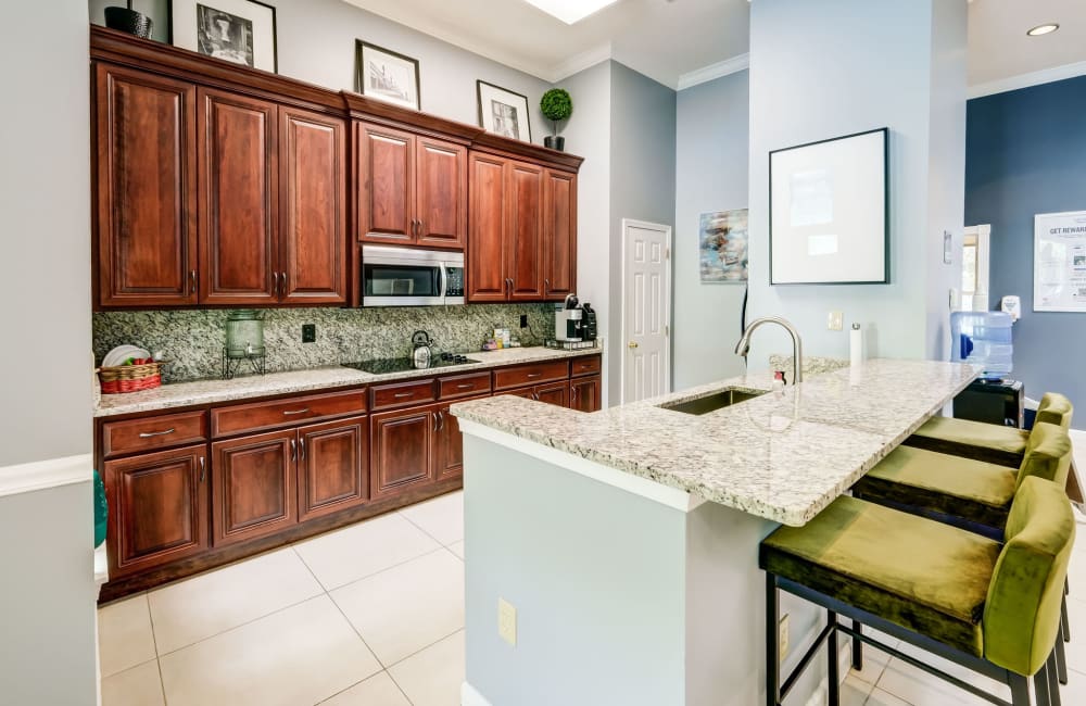 Beautiful modern kitchen with dining area and utilities located at Highlands of Montour Run in Coraopolis, Pennsylvania 
