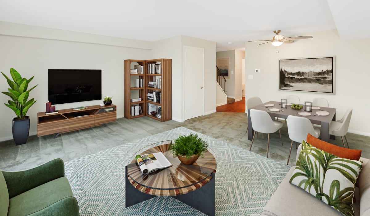 Spacious living room with dining area atThe Village of Laurel Ridge & The Encore Apartments & Townhomes apartments in Harrisburg, Pennsylvania