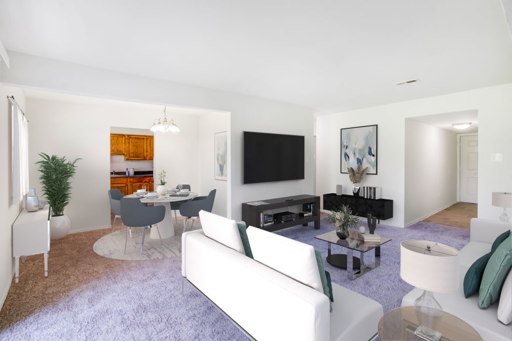Spacious living room with view of the dining area at Lumberton Apartment Homes in Lumberton, NJ