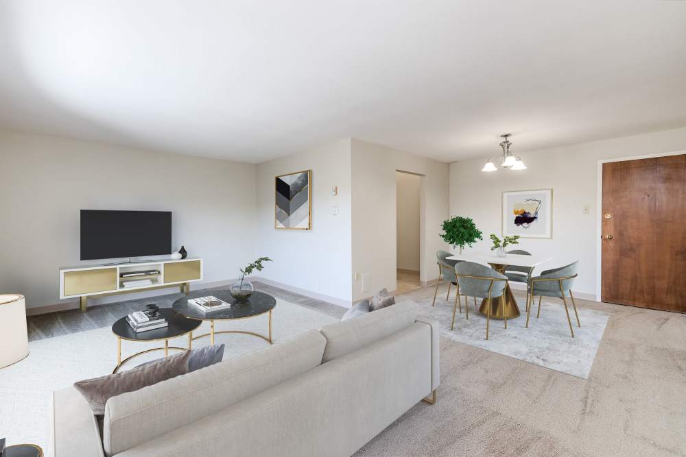 Spacious living room at Maiden Bridge & Canongate Apartments in Pittsburgh, Pennsylvania
