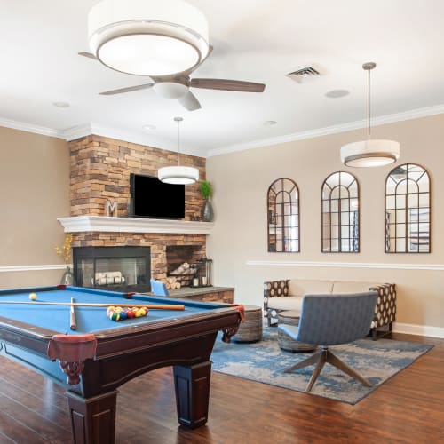 Clubhouse with fireplace and game area at Montgomery Manor Apartments & Townhomes in Hatfield, Pennsylvania