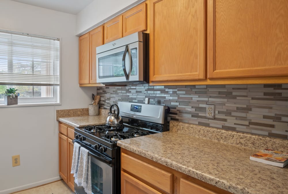 Kitchen with stainless-steel appliances in a home at Mount Vernon Square Apartment Homes in Alexandria, Virginia