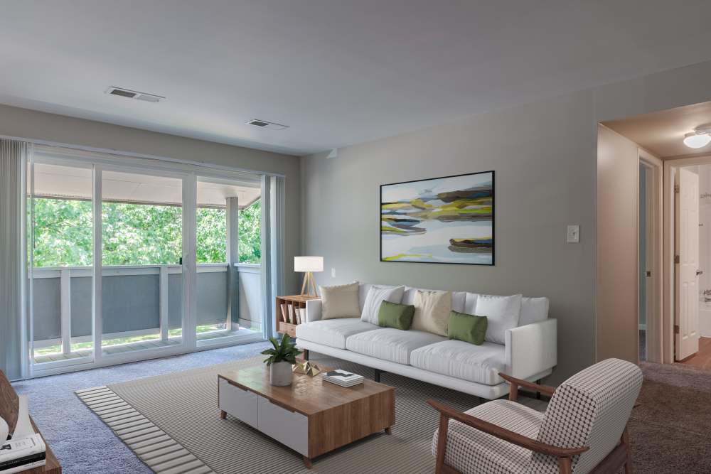 Living room with sliding glass door leading to balcony at Nineteen North Apartments in Pittsburgh, Pennsylvania