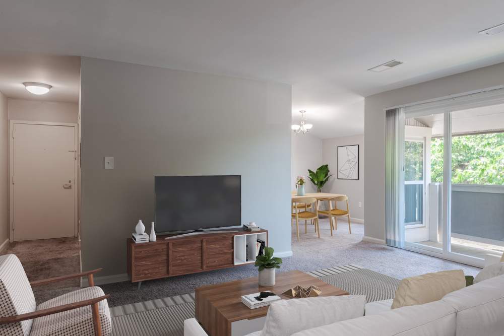 Living room with sliding door to balcony at Nineteen North Apartments in Pittsburgh, Pennsylvania