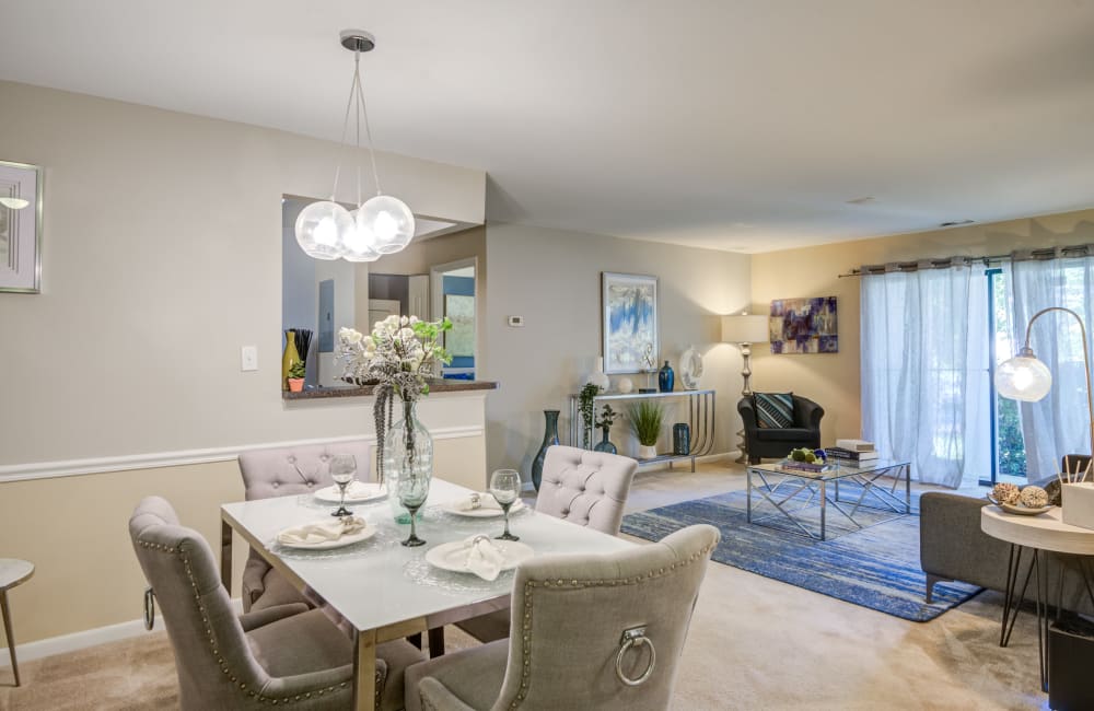 Living room with carpeting in a model home at Northampton Apartment Homes in Largo, Maryland
