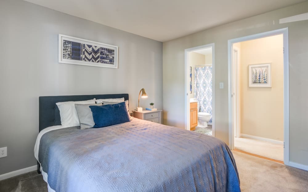 Model bedroom with attached bath at Northampton Apartment Homes in Largo, Maryland