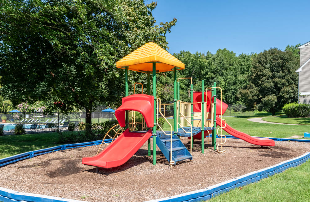 Exterior with private patio and lush lawn at Northampton Apartment Homes in Largo, Maryland