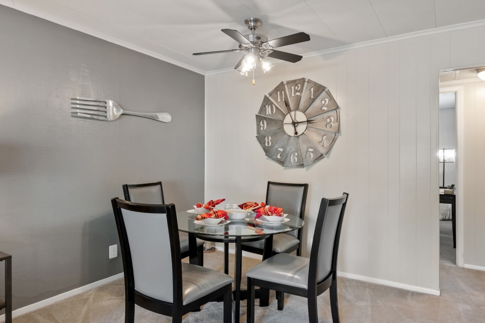 Minimalist Dining Room with Plush Carpeting at Oxford Manor Apartments & Townhomes in Mechanicsburg, Pennsylvania