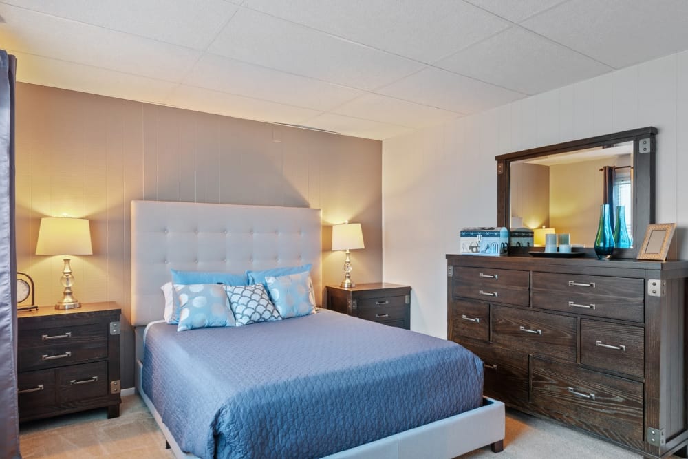Cozy bedroom with ambient lighting at Oxford Manor Apartments & Townhomes in Mechanicsburg, Pennsylvania