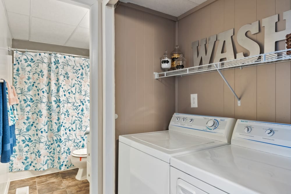Laundry area and modern bathroom at Oxford Manor Apartments & Townhomes in Mechanicsburg, Pennsylvania