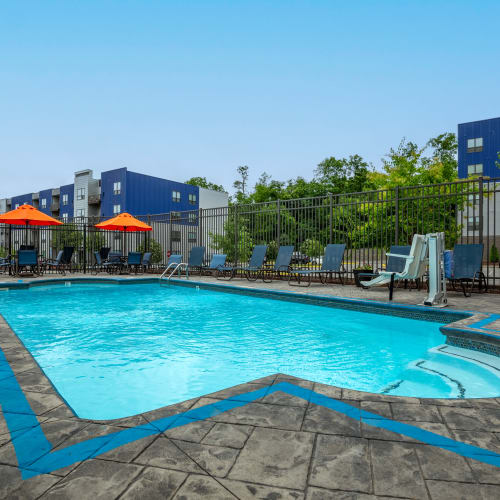 Outdoor seating and heated swimming pool at Park West 205 Apartment Homes in Pittsburgh, Pennsylvania