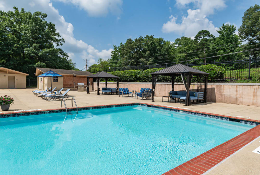 Swimming pool with lounge chairs and cabanas at Parke Laurel Apartment Homes apartments in Laurel, Maryland