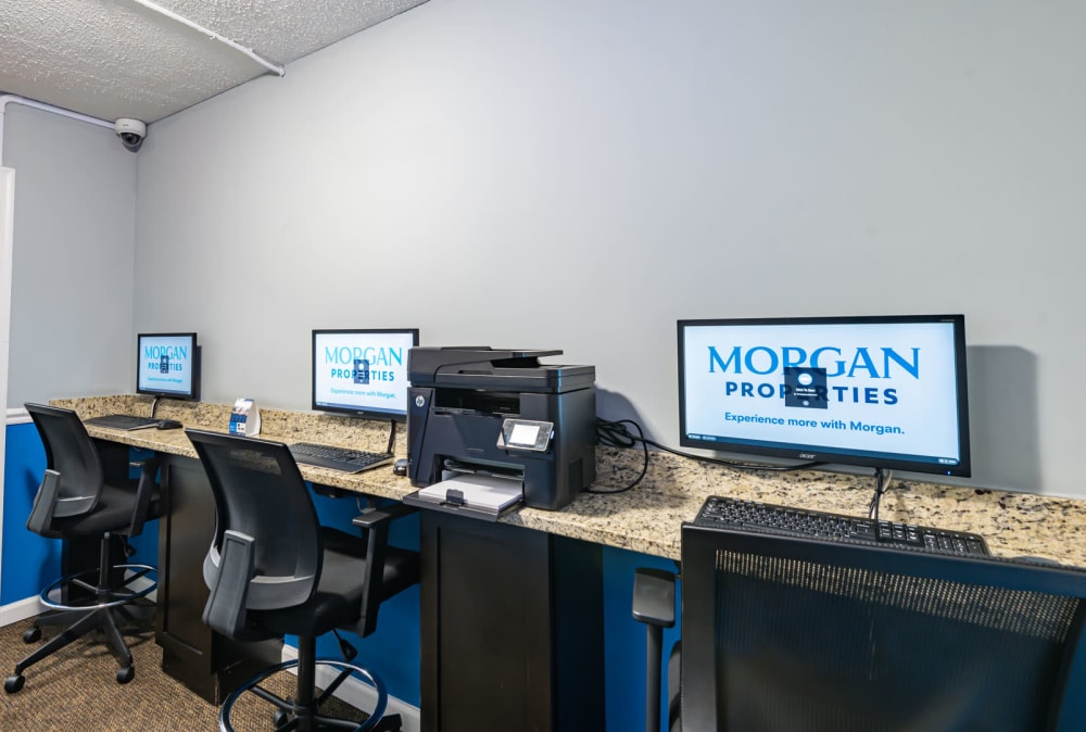 Business center with three computers and a printer at Parke Laurel Apartment Homes apartments in Laurel, Maryland