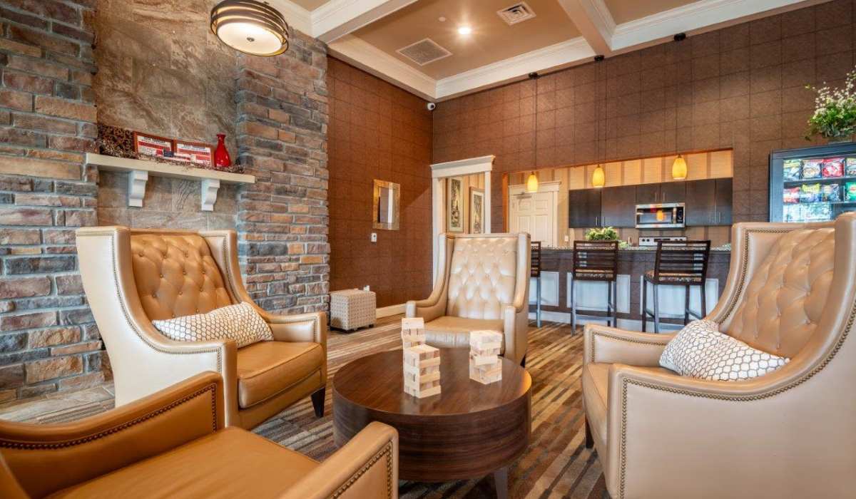 Cozy living room with couch, coffee table, and fireplace at Reserve at Southpointe, Canonsburg, Pennsylvania
