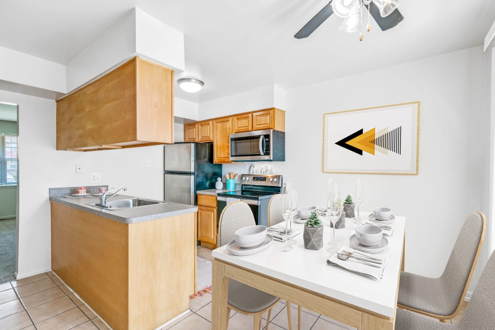 Kitchen and dining area at Roberts Mill Apartments & Townhomes in Maple Shade, New Jersey