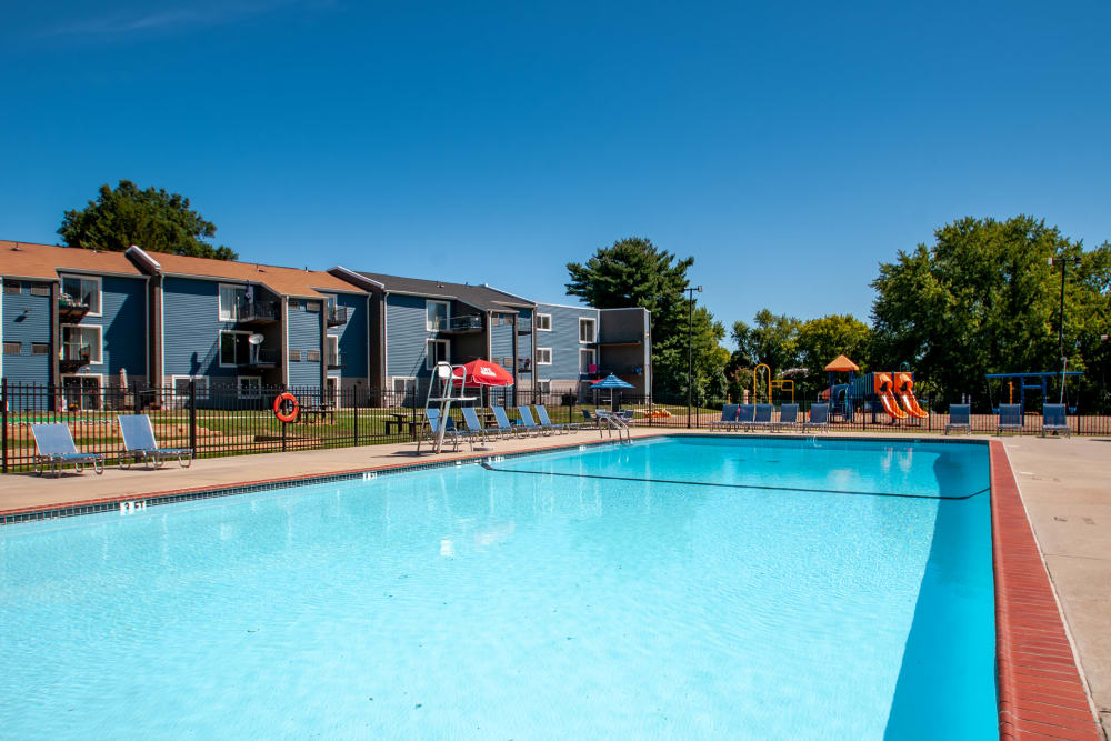 Swimming Pool with Sun Loungers at Sherwood Crossing Apartments & Townhomes in Philadelphia, Pennsylvania